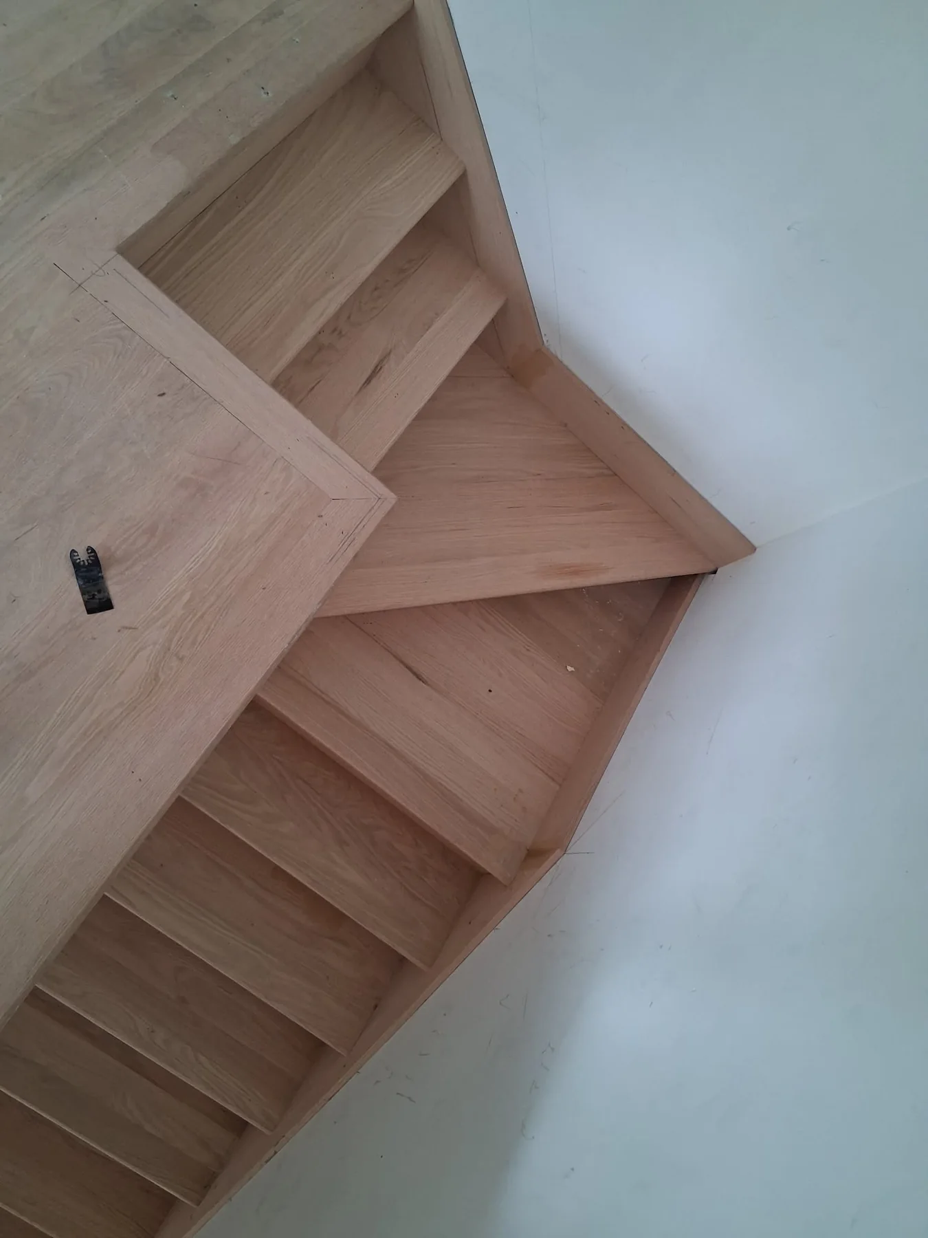 Custom hardwood staircase installation detail